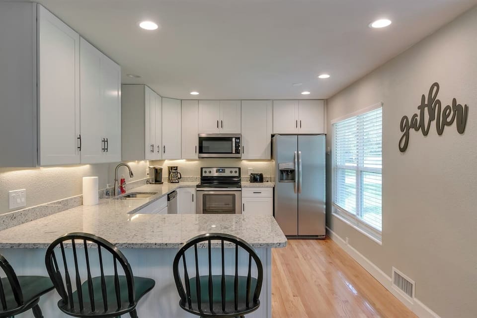 Remodeled kitchen with granite and stainless steel appliances