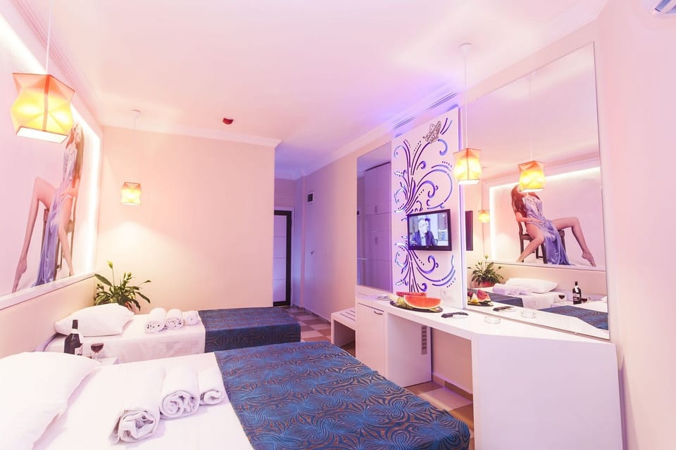Standard Double Room, Women only, Balcony, Pool View | Minibar, desk, laptop workspace, iron/ironing board