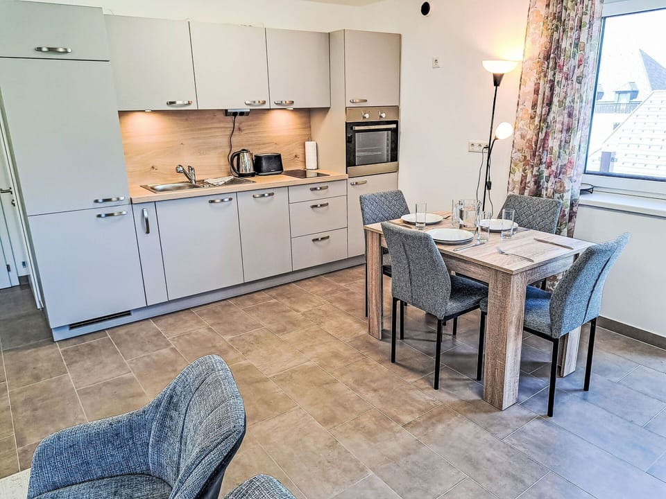 Furniture, Flooring, Interior Design, Floor, Countertop, Cabinetry, Kitchen, Kitchen & Dining Room Table, Apartment, Chair