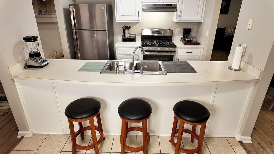 Full kitchen with microwave, coffee maker, blender, all essentials.