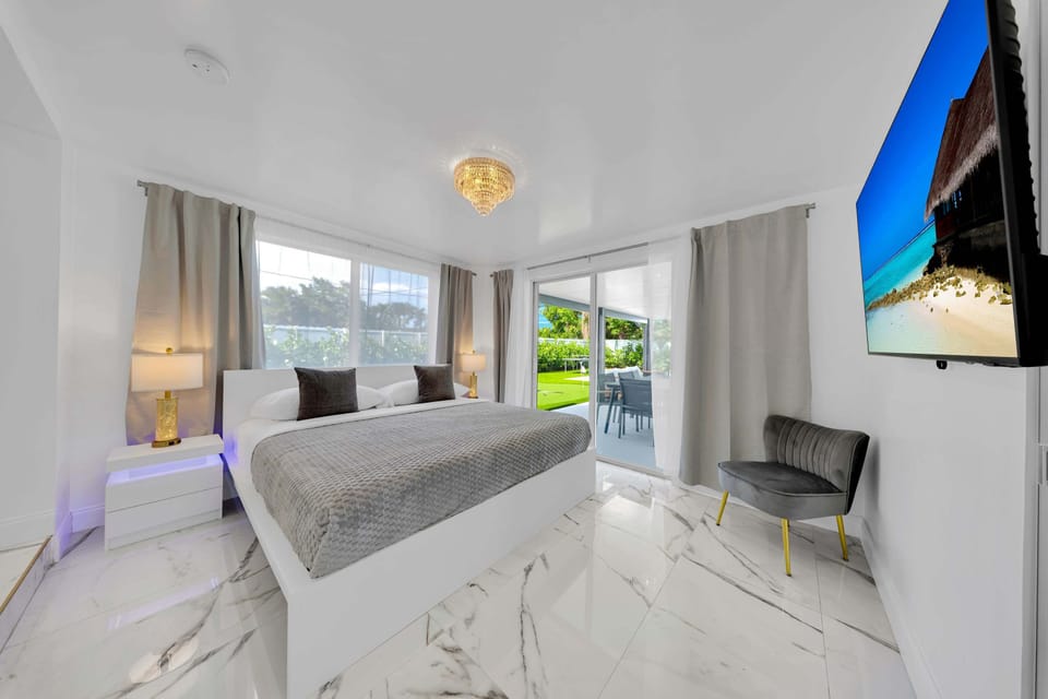 Bright Bedroom Featuring Closet and Smart TV