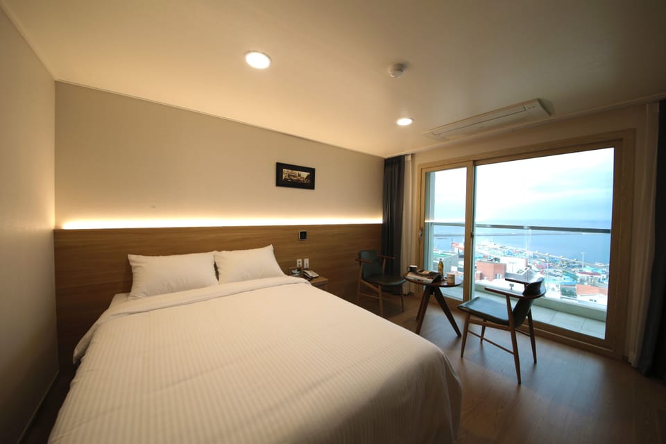 Deluxe Double Room, Ocean View | Blackout drapes, soundproofing, free WiFi