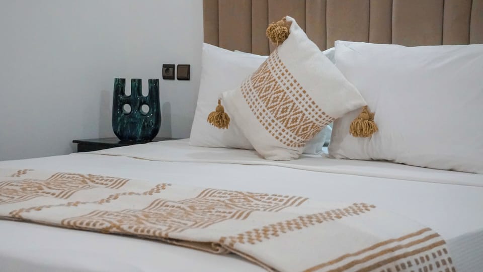 Comfort Double Room | Minibar, blackout drapes, iron/ironing board, bed sheets
