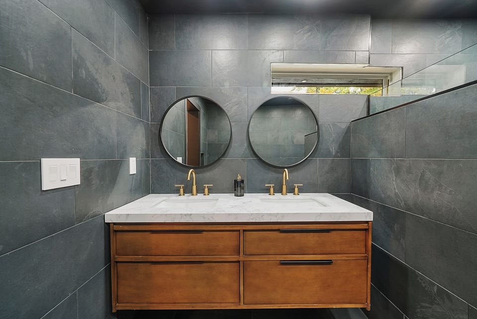 Upstairs primary bathroom with double vanity