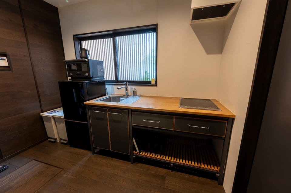 Villa | Private kitchen | Full-size fridge, microwave, cookware/dishes/utensils