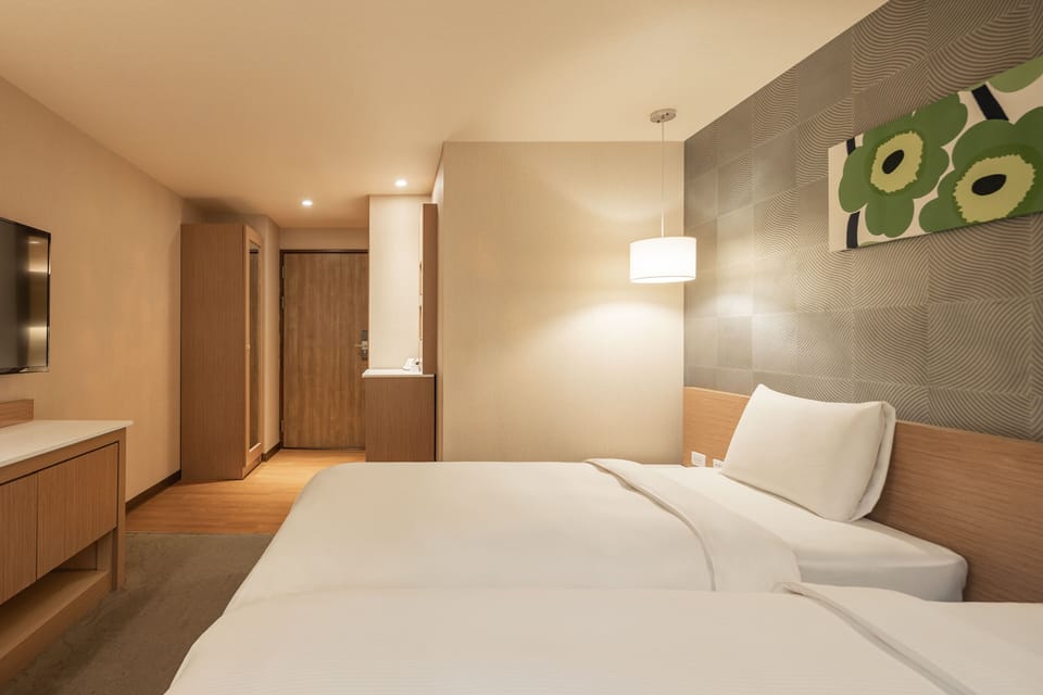 Business Twin Room | Living area | 42-inch LCD TV with cable channels, TV