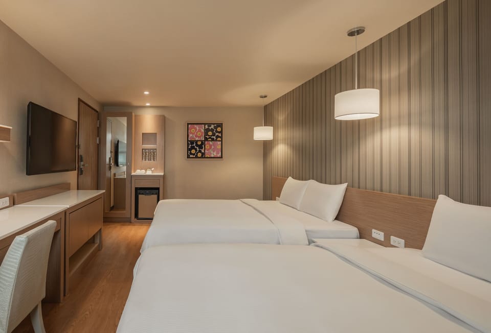Comfort Quadruple Room | Premium bedding, desk, soundproofing, free cribs/infant beds