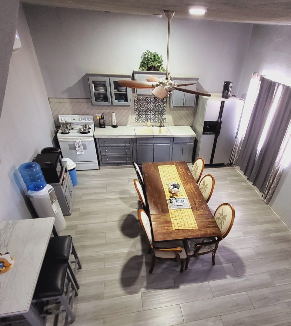 Large kitchen on ground floor with large dining table.