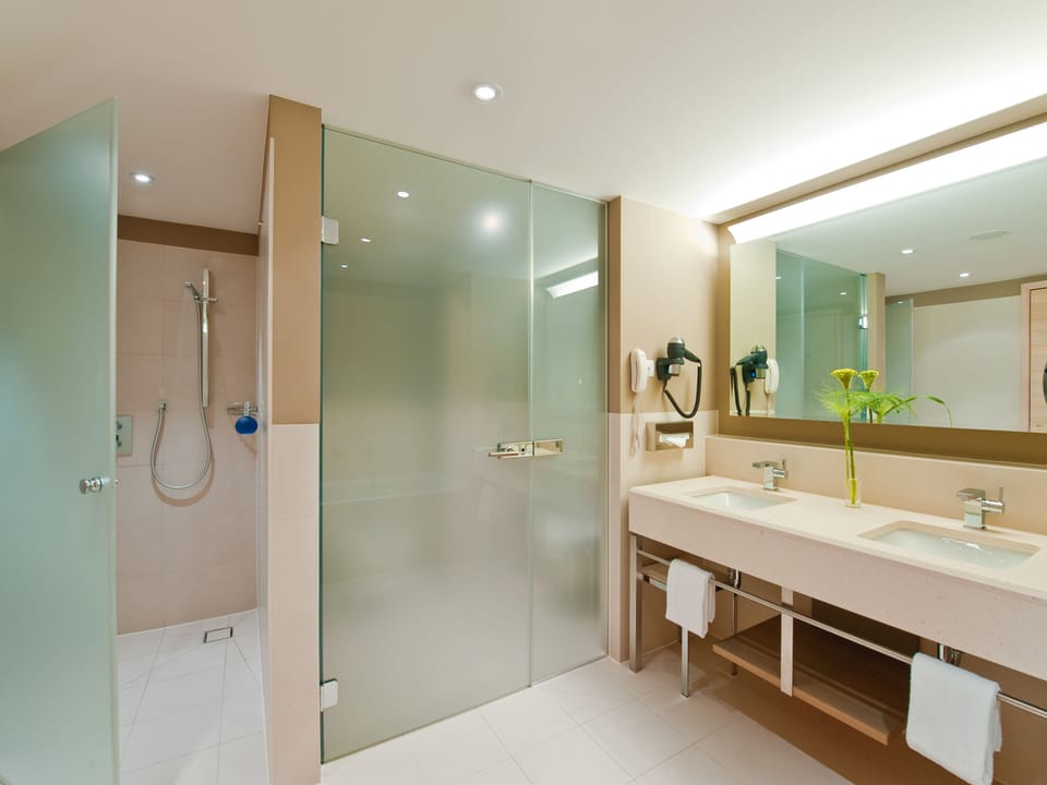 Separate tub and shower, rainfall showerhead, eco-friendly toiletries