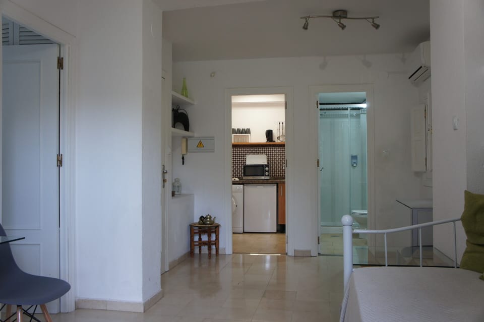 City Apartment | Living area | 32-inch flat-screen TV with digital channels, TV