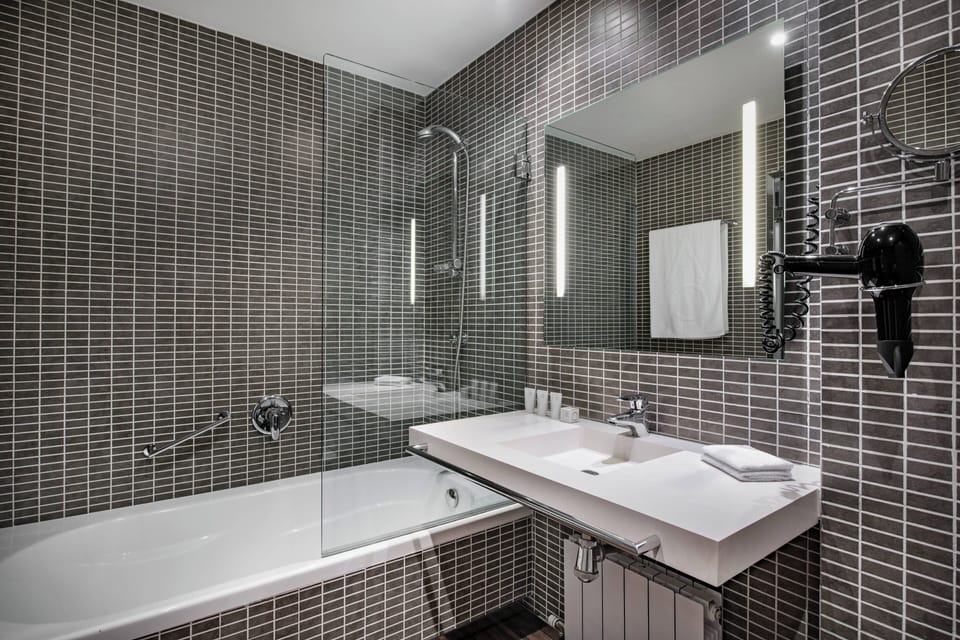 Designer toiletries, hair dryer, bidet, towels