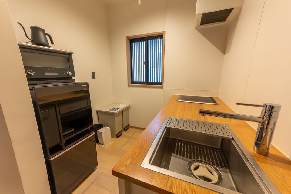 Villa | Private kitchen | Full-size fridge, microwave, cookware/dishes/utensils