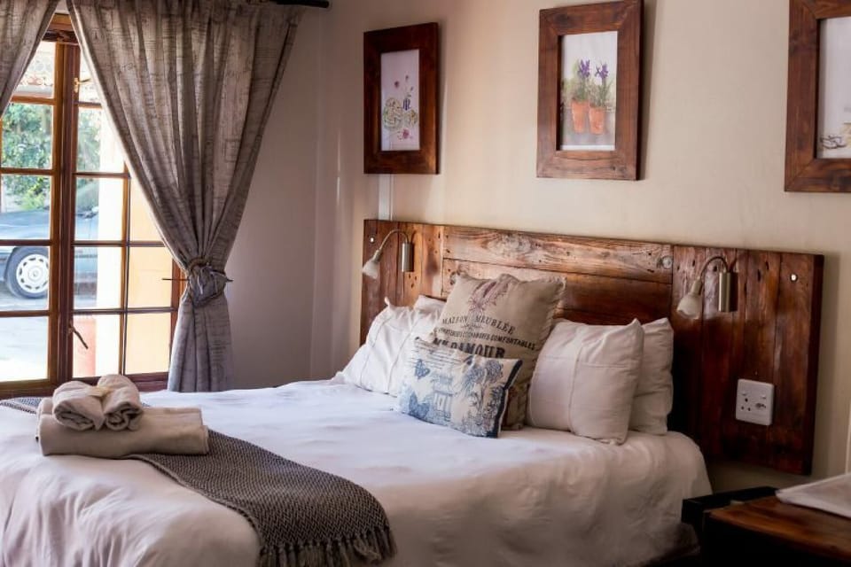 Premium bedding, desk, laptop workspace, iron/ironing board