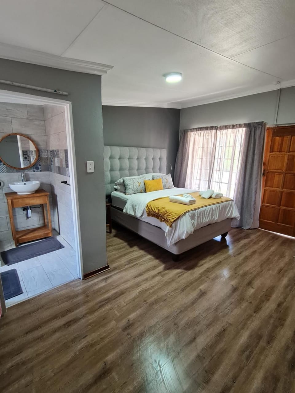 Premium bedding, desk, laptop workspace, iron/ironing board