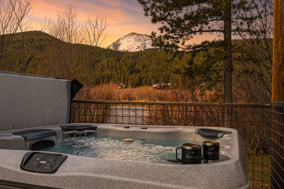 Soak in the private hot tub while taking in snow-capped mountain views and peaceful alpine scenery.