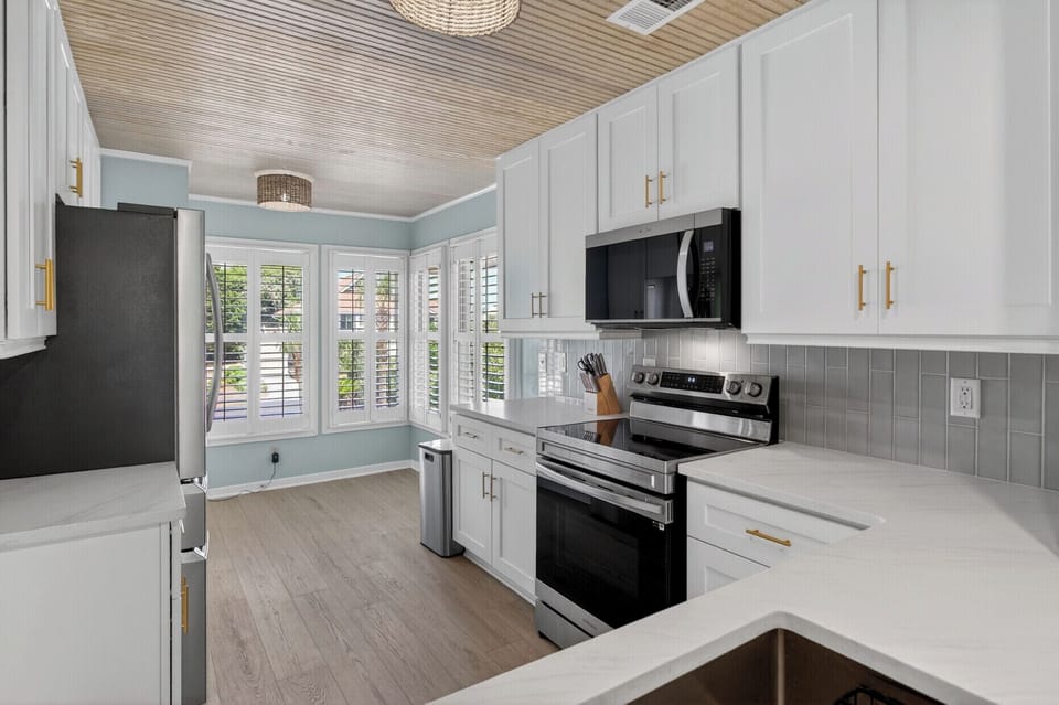 Whip up your favorite meals in this bright coastal kitchen featuring modern appliances and plenty of natural light.