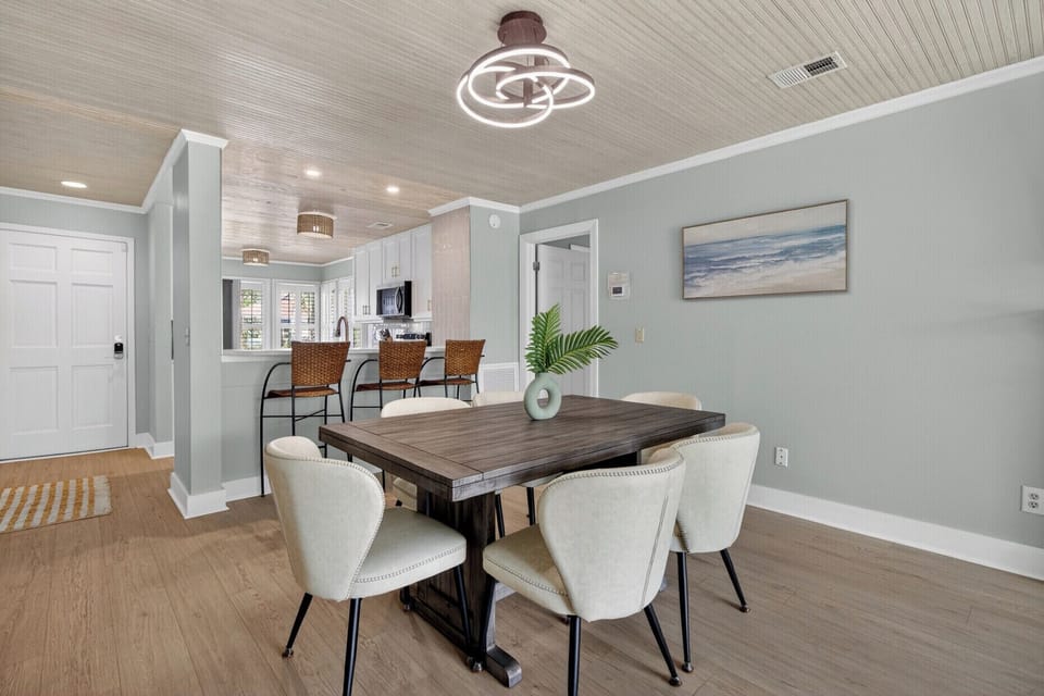 Enjoy effortless coastal living with an open dining and lounge space designed for gathering after beach days.