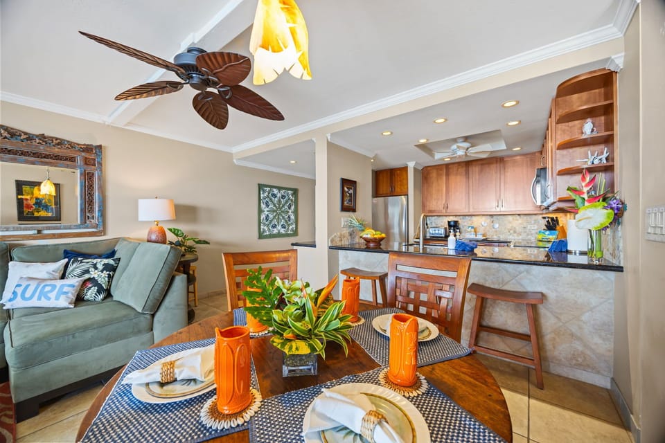 Enjoy the seamless flow between the elegantly set dining area, the cozy living room, and the fully equipped kitchen with a breakfast bar 