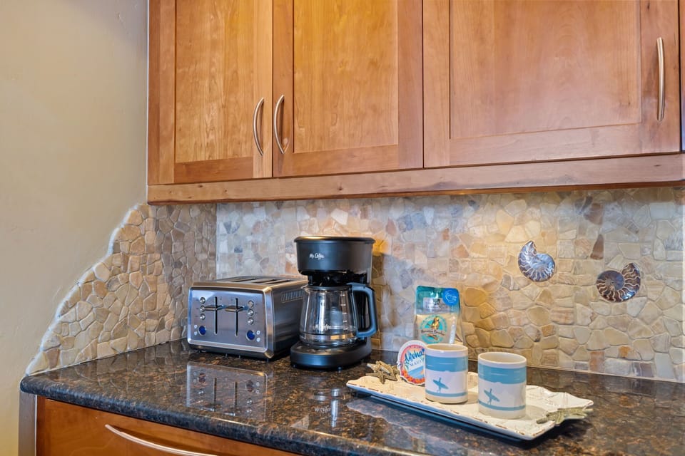 Drip Coffee Maker with reusable Gold Filter, Ground Coffee & Filtered Water Pitcher provided.