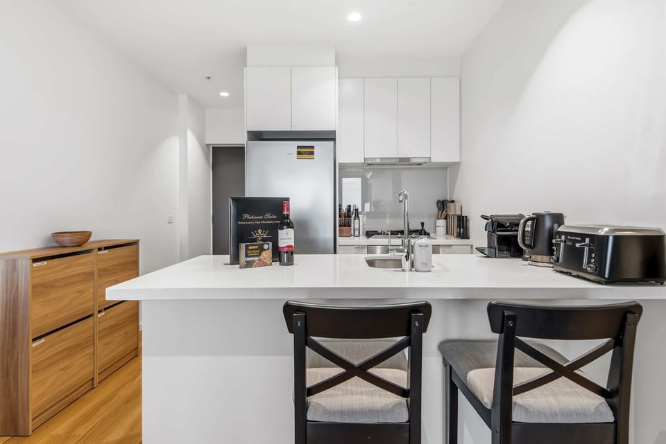 A sleek modern kitchen fully equipped for effortless cooking, dining, and everyday convenience.