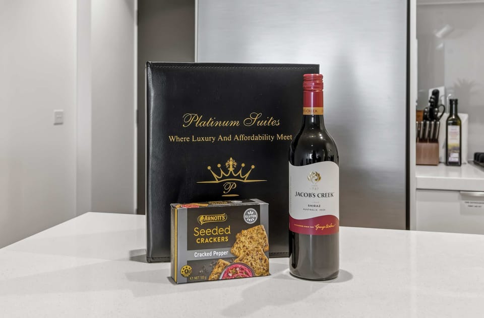 Experience the perfect welcome with a bottle of Jacob's Creek Shiraz and Arnott's Seeded Crackers. Presented by Platinum Suites, it's the ideal touch "where luxury and affordability meet".