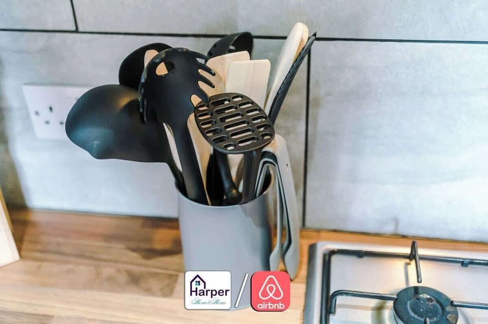 Modern fully equipped kitchen with wooden cabinets.
Includes oven, hob, fridge, microwave, toaster, and kettle.
Perfect for cooking meals during long or short stays.
