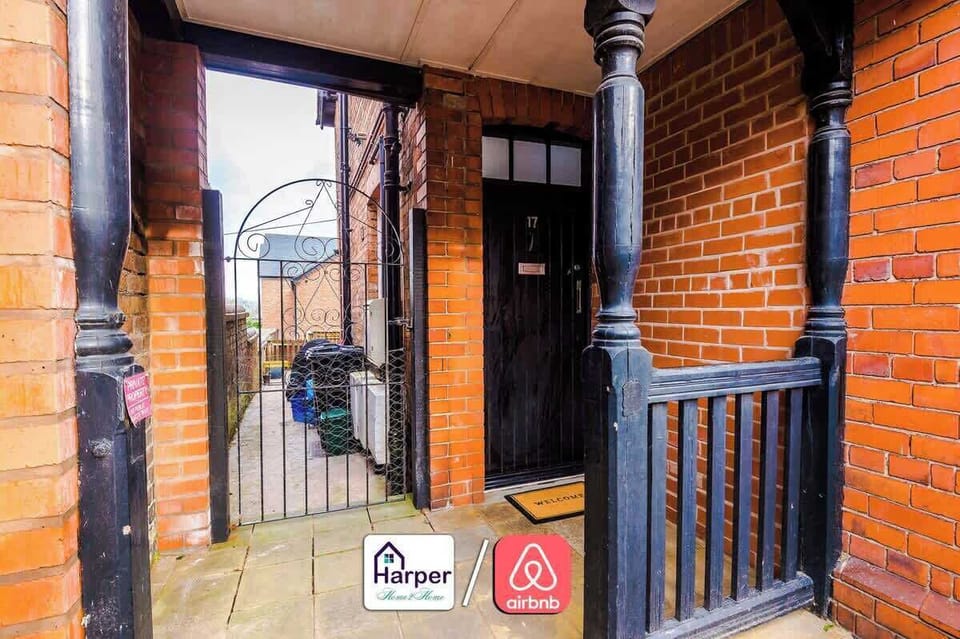 Traditional brick exterior with a private gated entrance.
Secure front door leading into a bright hallway.
Welcoming and safe access for all guests.