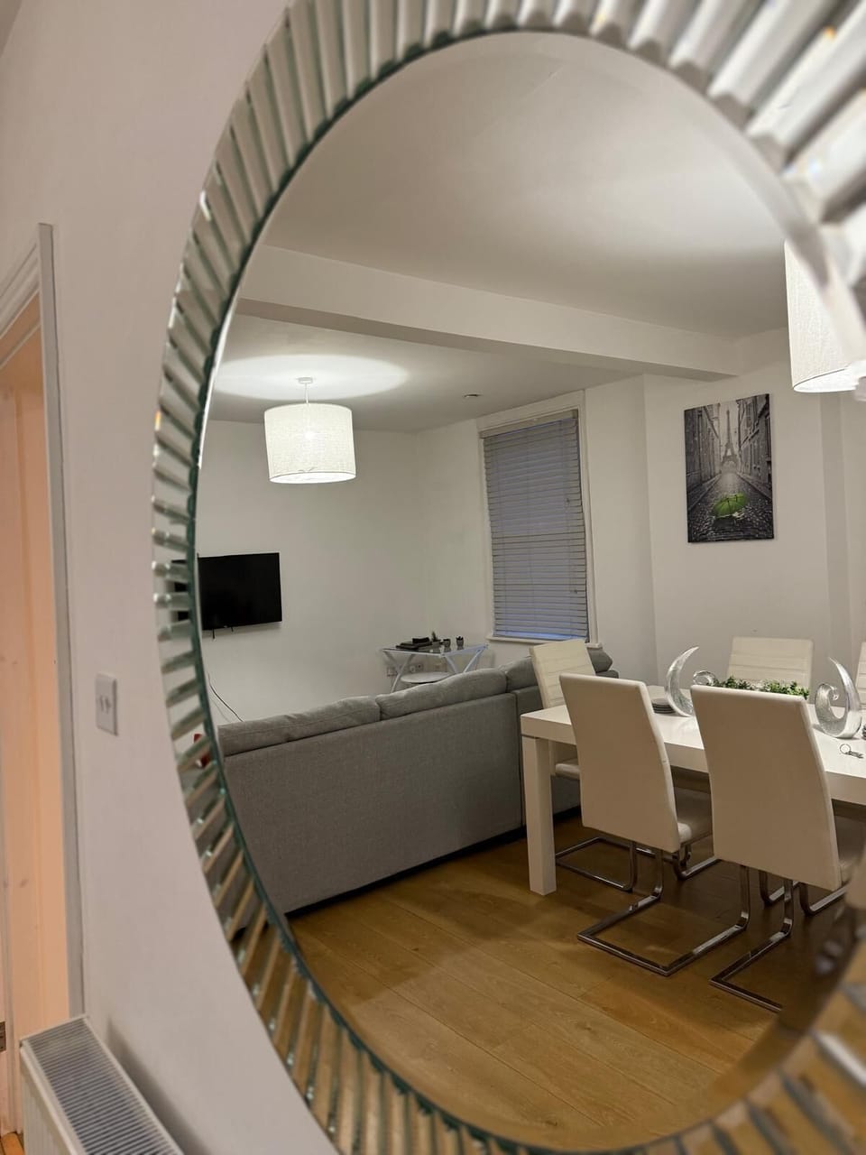 Spacious dining area with modern table settings, perfect for group meals and gatherings