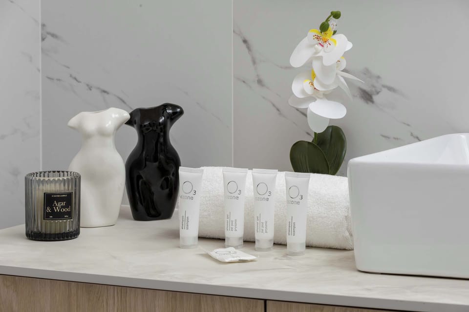 A bathroom detail with elegant accessories, modern fixtures, and clean minimalist styling.