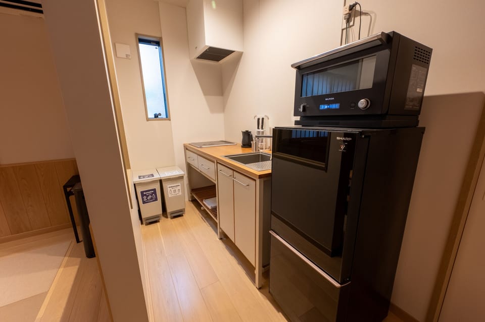 Villa | Private kitchen | Full-size fridge, microwave, cookware/dishes/utensils
