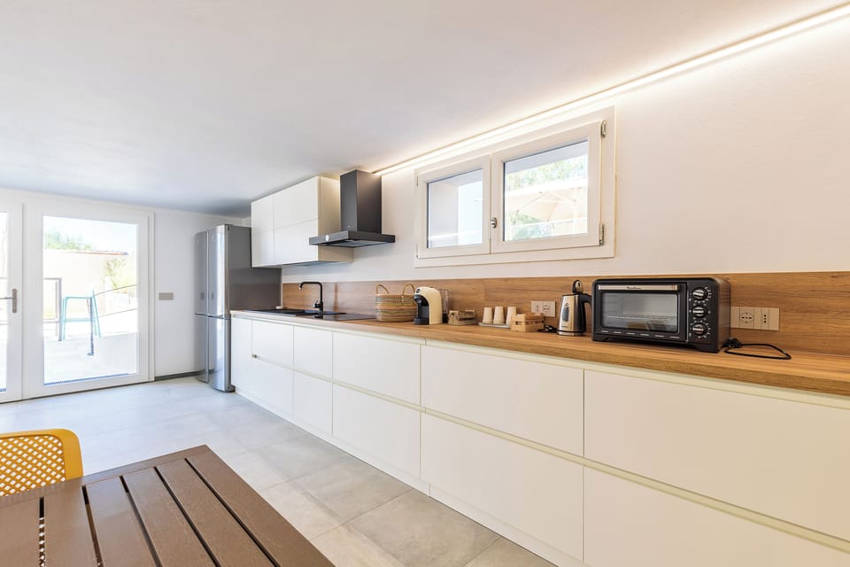 Apartment, Pool View | Private kitchen | Full-size fridge, coffee grinder, cookware/dishes/utensils