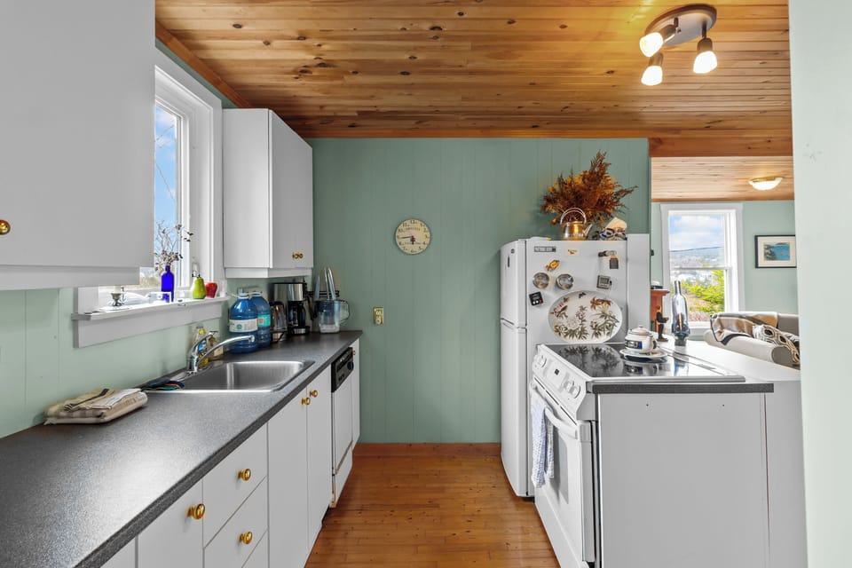 Bright kitchen with cabinet storage and farmhouse touches