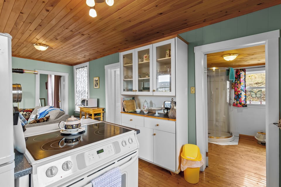 Bright kitchen with cabinet storage and farmhouse touches