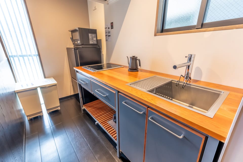 Villa | Private kitchen | Full-size fridge, microwave, cookware/dishes/utensils