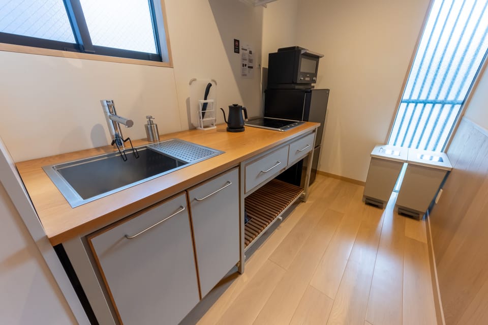 Villa | Private kitchen | Full-size fridge, microwave, cookware/dishes/utensils