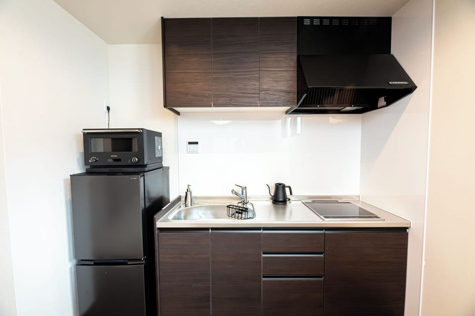 Villa | Private kitchen | Full-size fridge, microwave, cookware/dishes/utensils