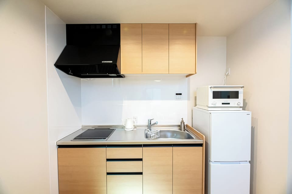 Villa | Private kitchen | Full-size fridge, microwave, cookware/dishes/utensils