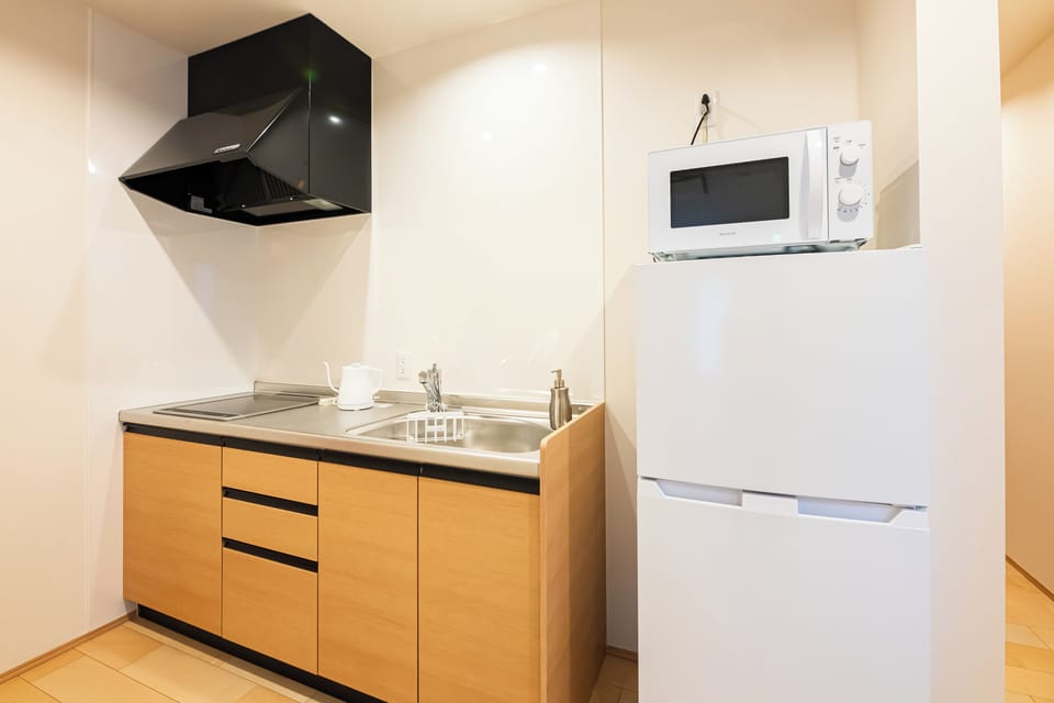 Villa | Private kitchen | Full-size fridge, microwave, stovetop, cookware/dishes/utensils