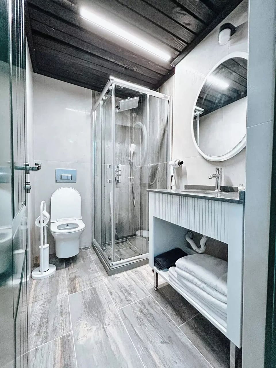Shower, hair dryer, slippers, towels