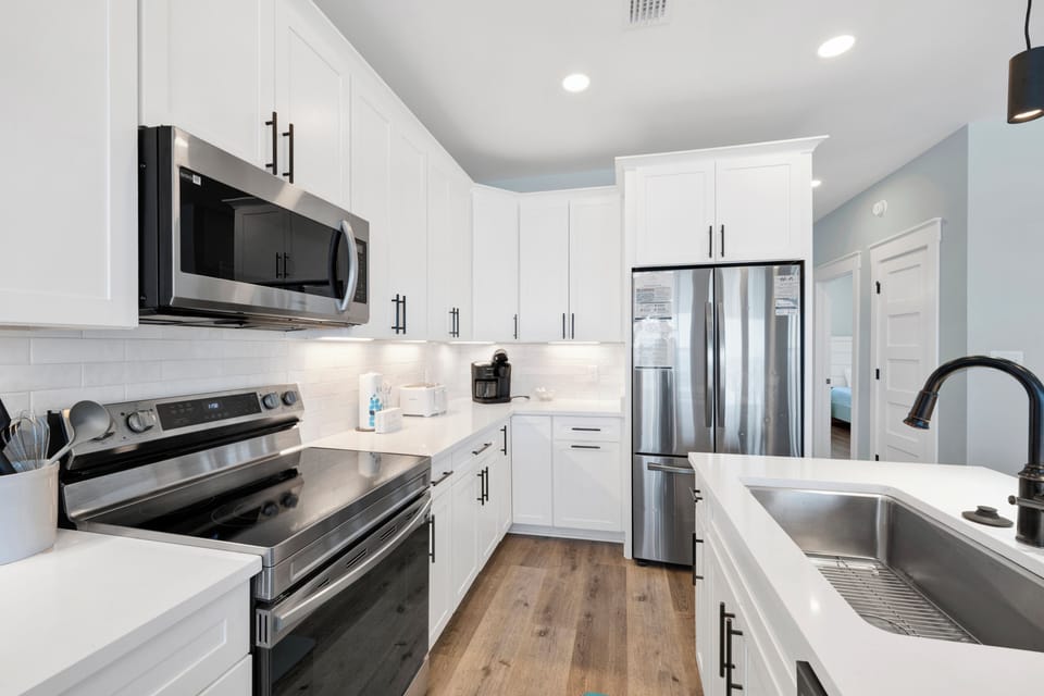 Stone counters and stainless steel appliances throughout