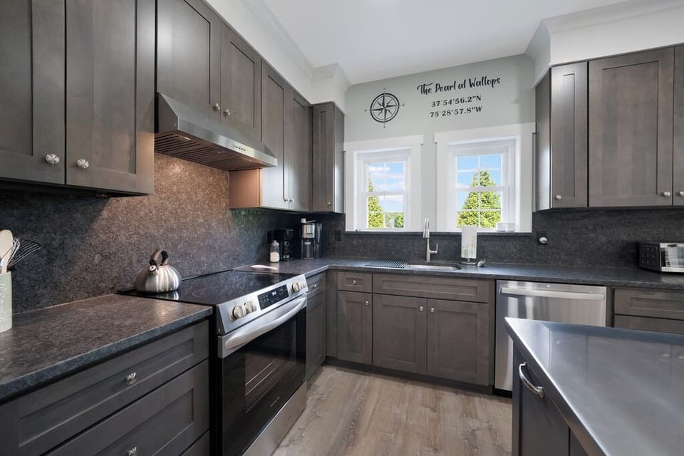 Stainless Appliances and rich wood cabinetry.