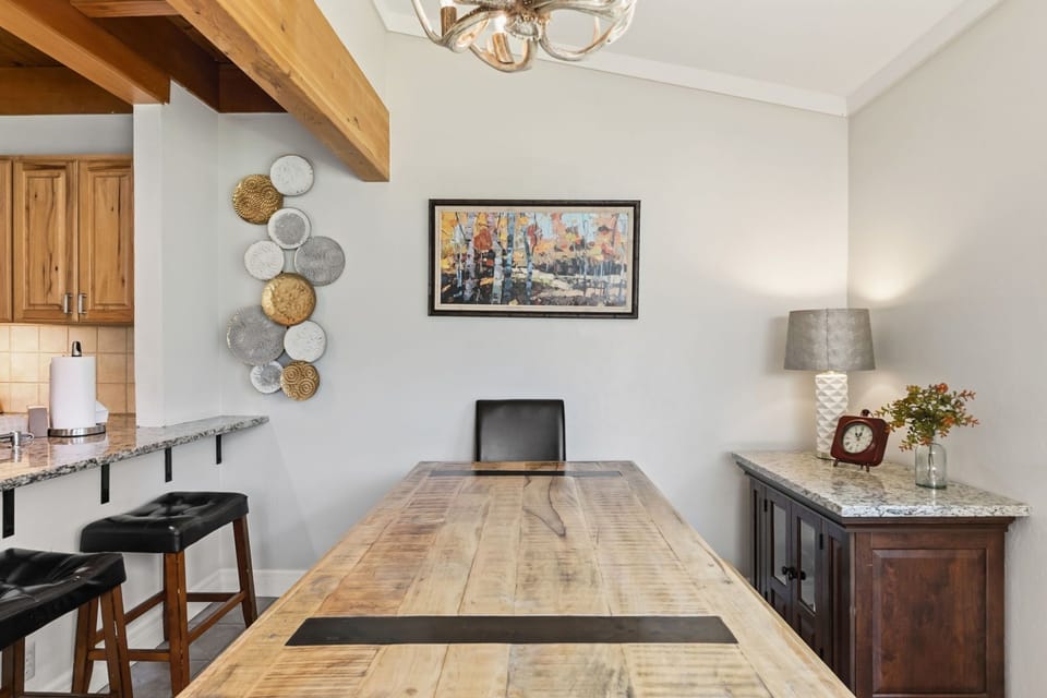 You'll love this inviting workspace with rustic wood beams, perfect for catching up on emails or planning your next mountain adventure.