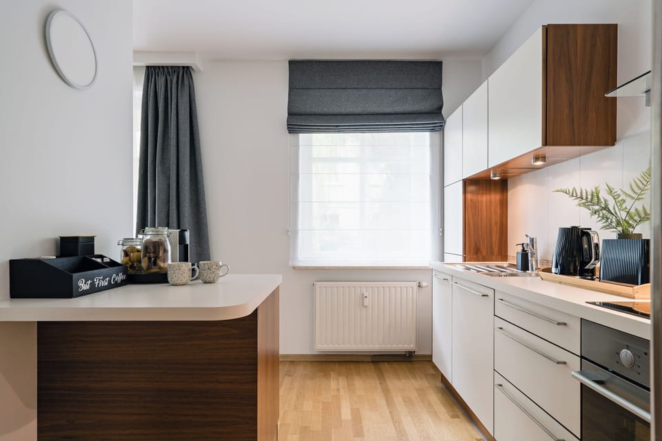 Family Apartment, 2 Bedrooms, Courtyard View | Private kitchen | Coffee/tea maker, electric kettle, toaster, highchair
