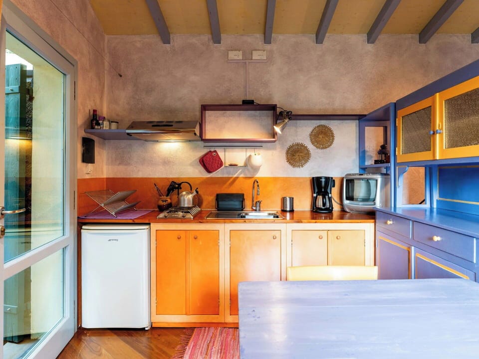 Furniture, Wood, Interior Design, Kitchen, Flooring, Ceiling, Lighting, Floor, Home, Countertop