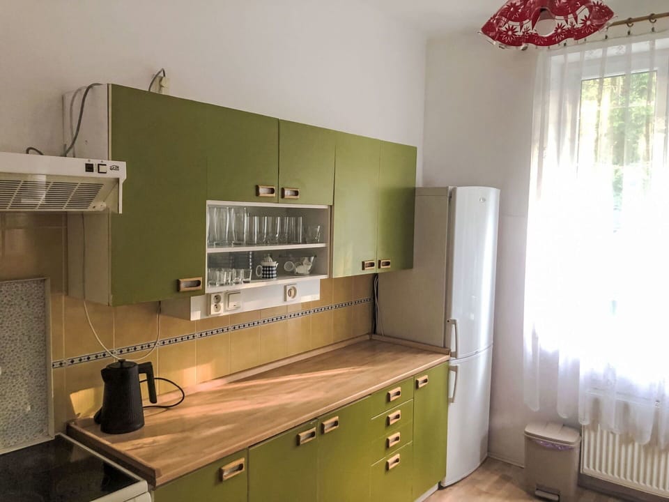 Flooring, Wood, Interior Design, Cabinetry, Kitchen, Countertop, Furniture, Floor, Kitchen Appliance, Cupboard