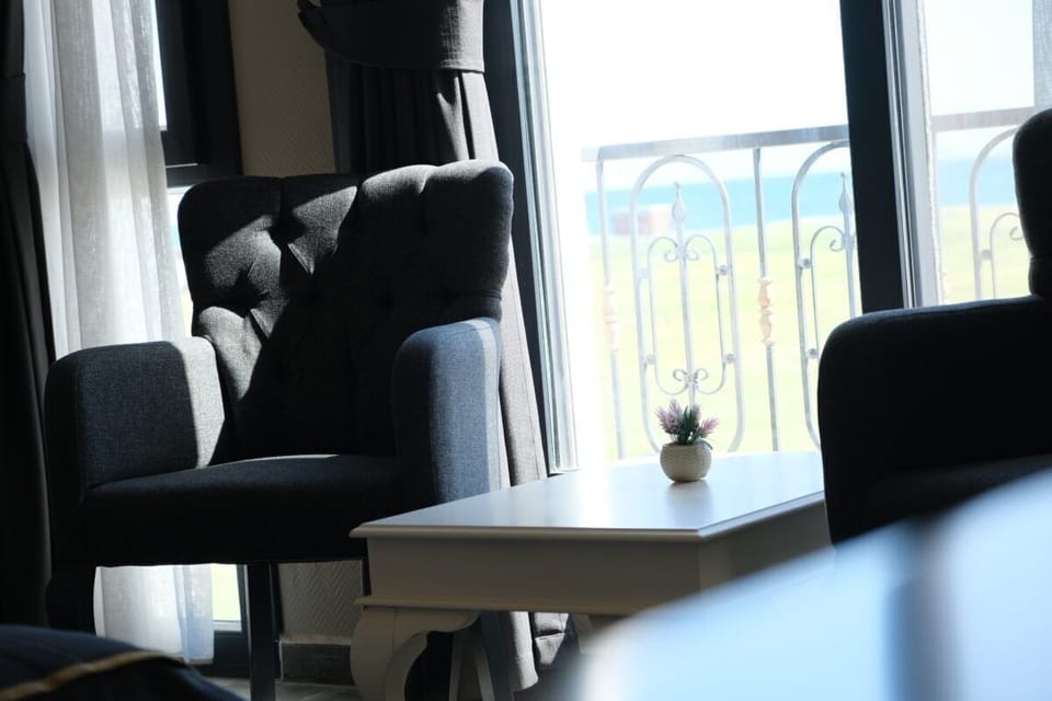Standard Room, Sea View | Living area | 70-inch LCD TV with satellite channels
