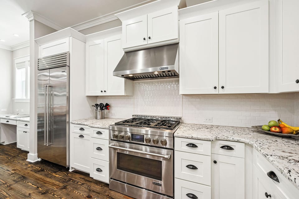 Picture yourself preparing meals in this bright, fully-equipped kitchen with granite counters, stainless appliances, and everything you need for your stay.