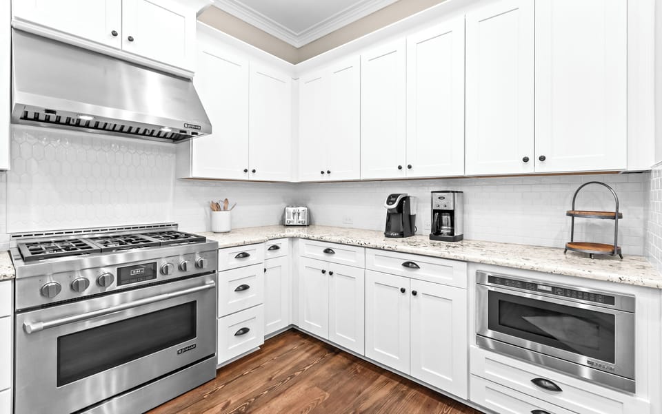 Your bright, fully-equipped kitchen invites you to prepare meals with ease. Granite countertops, stainless-steel appliances, and a coffee station make mornings feel effortless and peaceful.