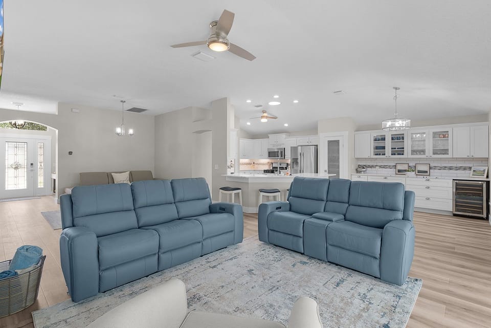 Settle into plush seating and enjoy an open, airy layout that seamlessly connects your living space to a fully equipped modern kitchen—perfect for gathering and entertaining.