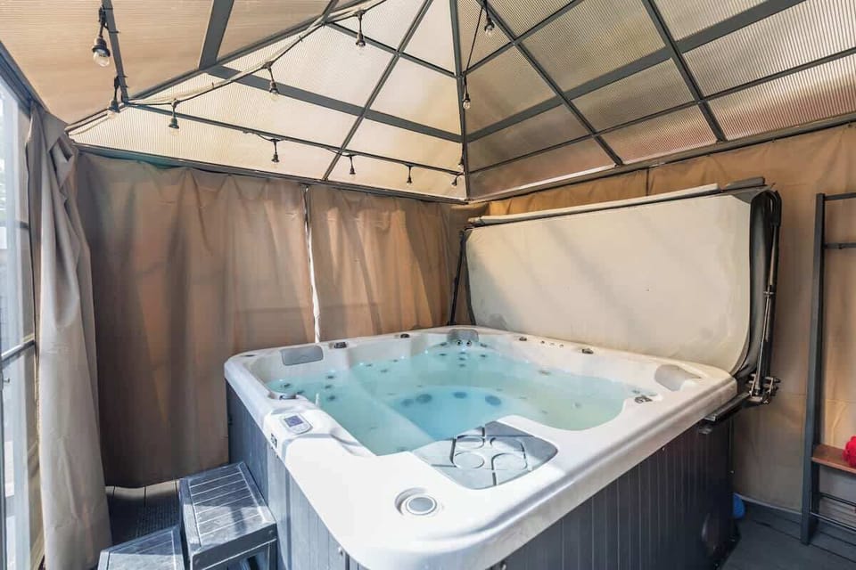 Relaxing hot tub under gazebo perfect for unwinding after days
